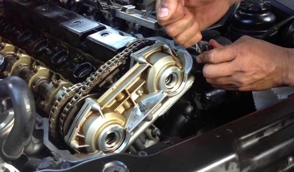 Technician working on a BMW timing chain